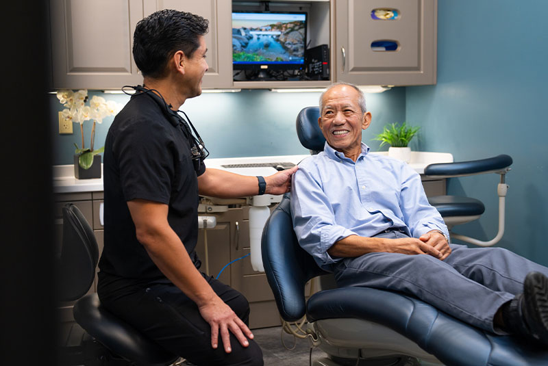 doctor and patient going over dental procedure information
